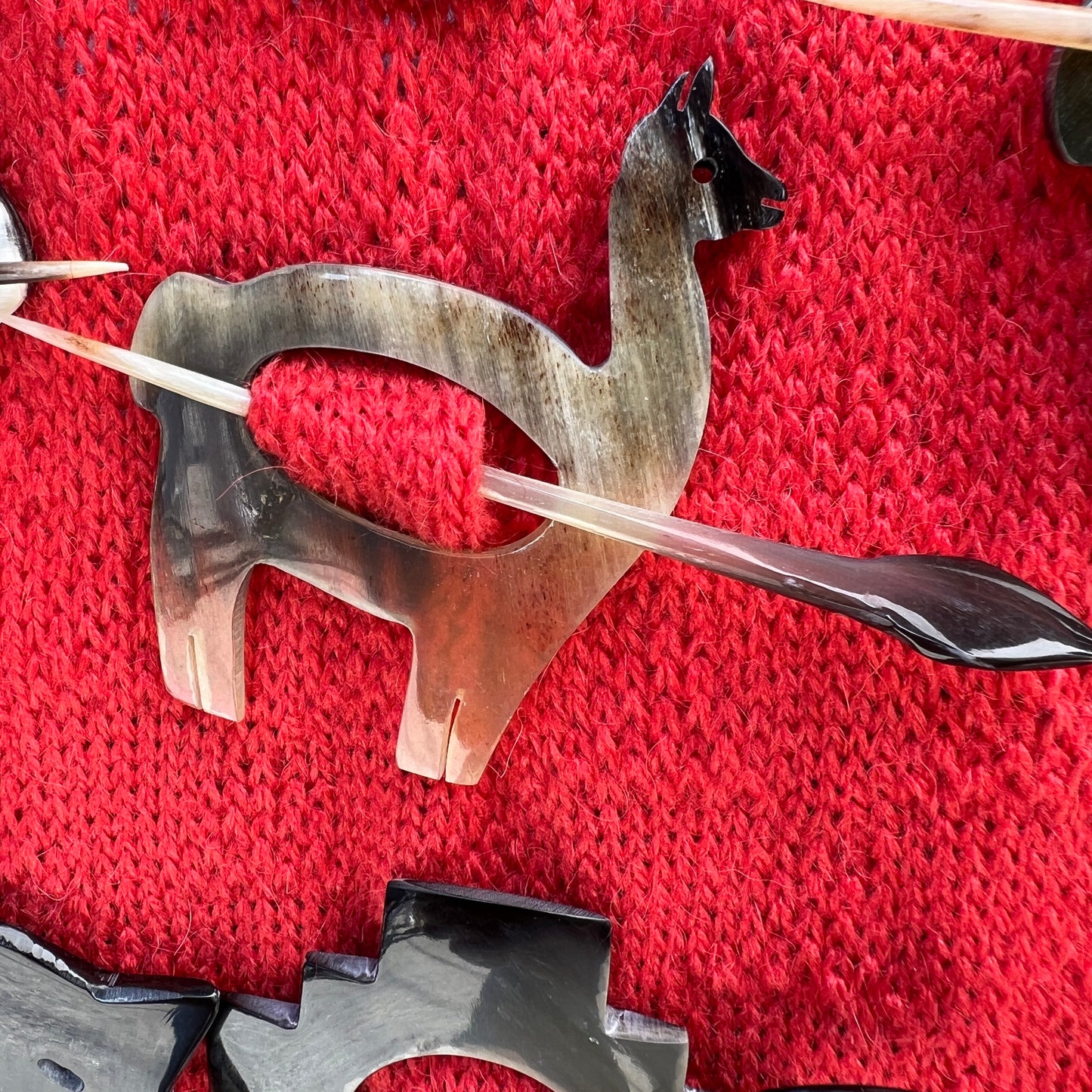 Luxury handmade sweater pins made from bull horns.