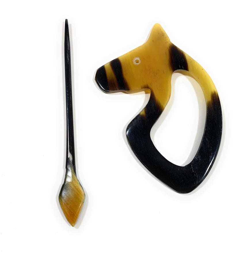 Luxury handmade sweater pins made from bull horns.