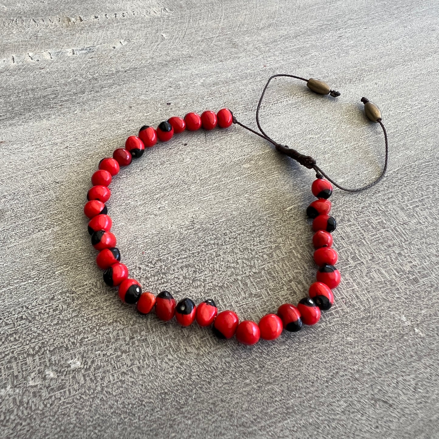 Peruvian Huayruro Seed Bracelet, for good luck.