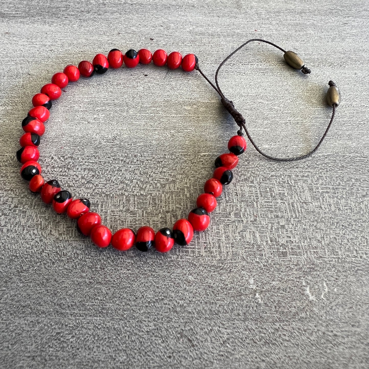 Peruvian Huayruro Seed Bracelet, for good luck.