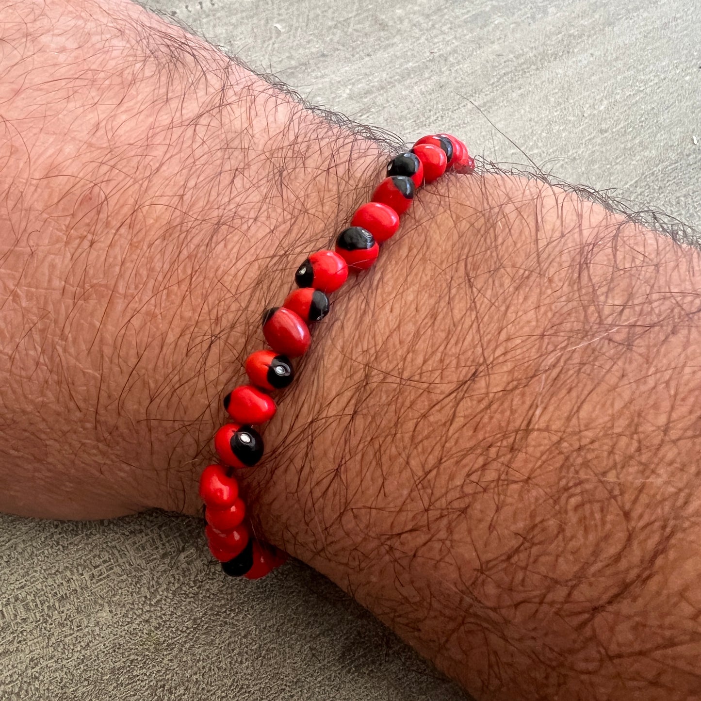 Peruvian Huayruro Seed Bracelet, for good luck.