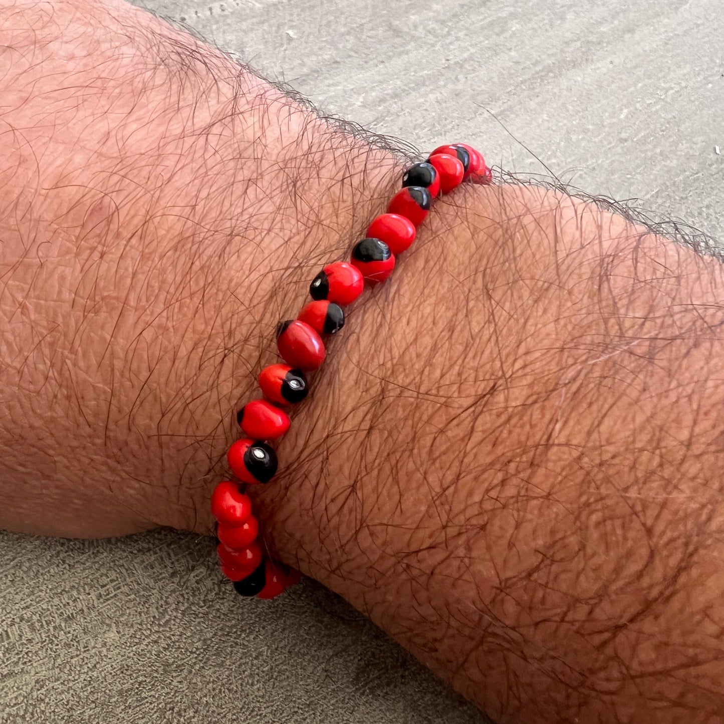 Peruvian Huayruro Seed Bracelet, for good luck.