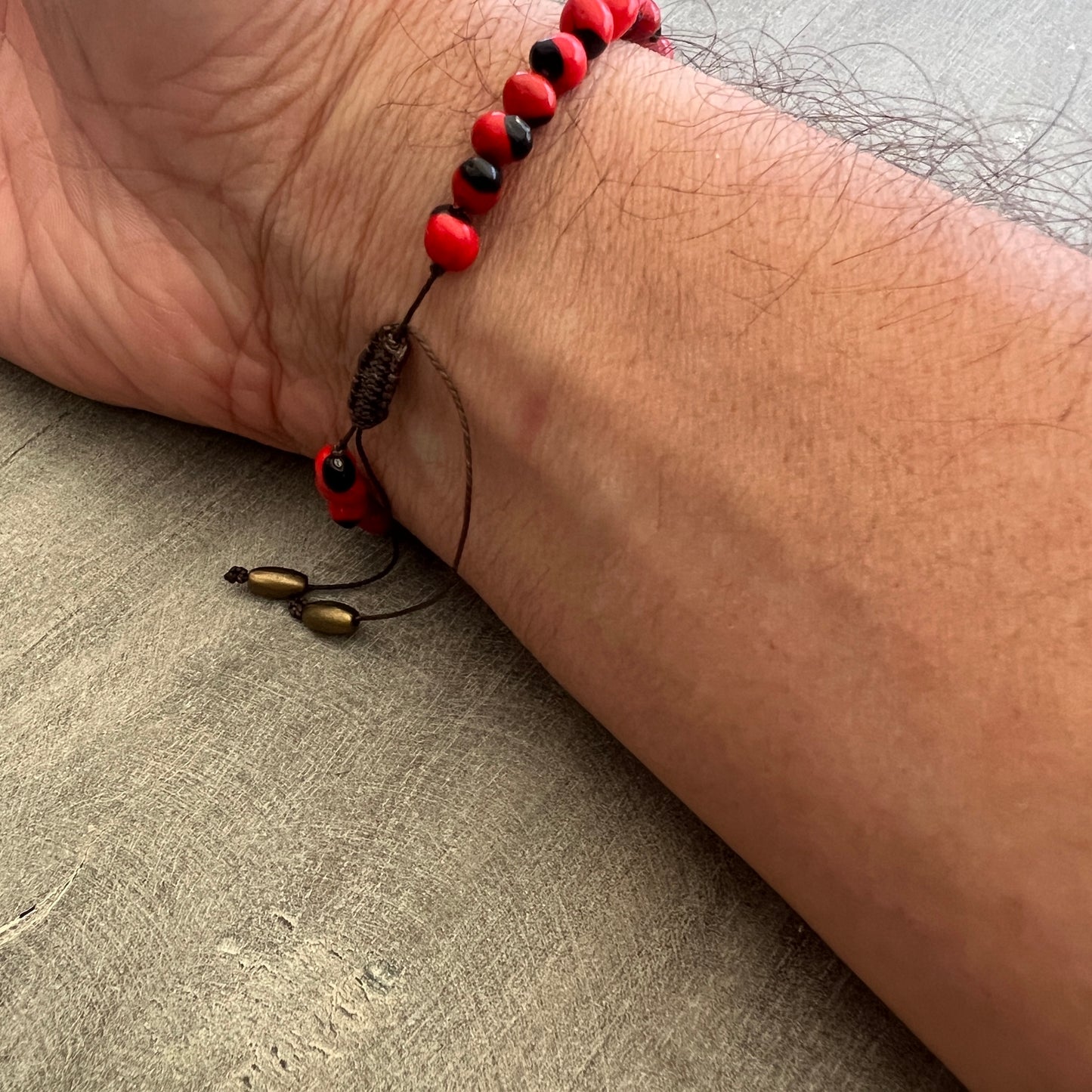 Peruvian Huayruro Seed Bracelet, for good luck.