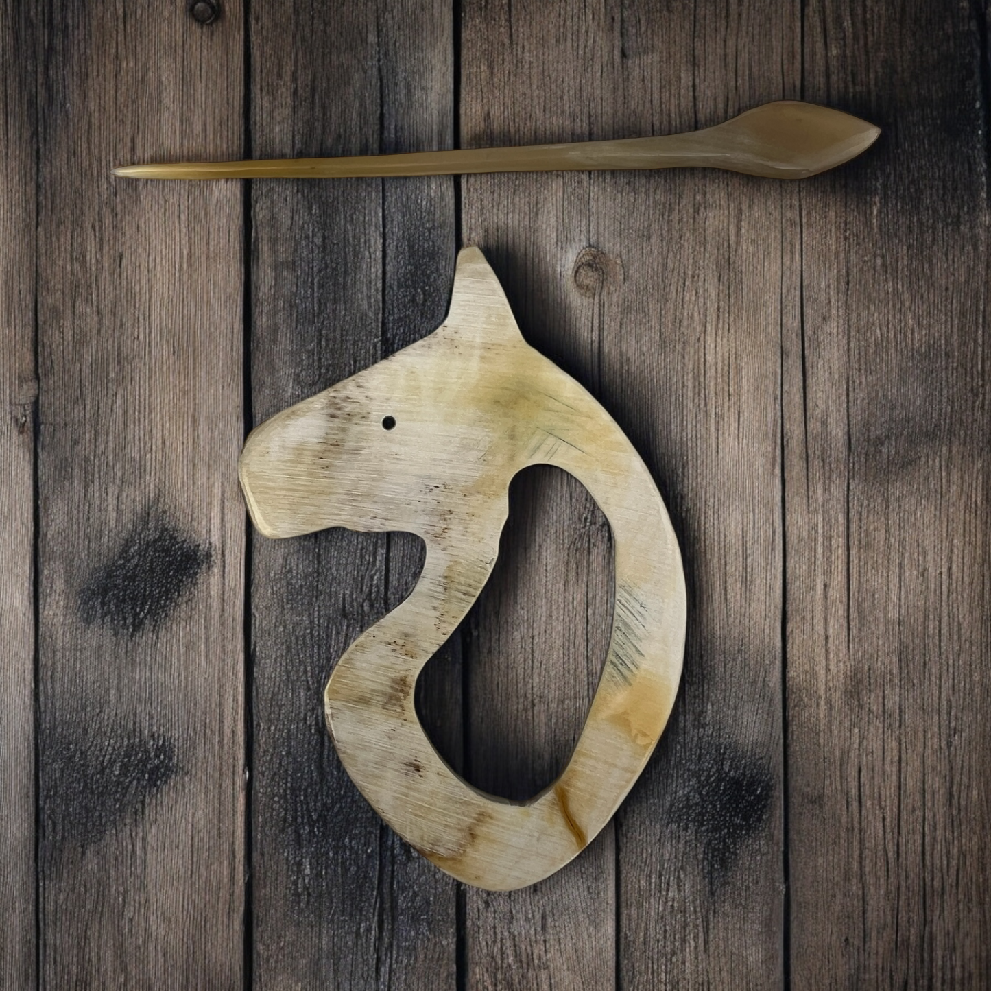 Luxury handmade sweater pins made from bull horns.