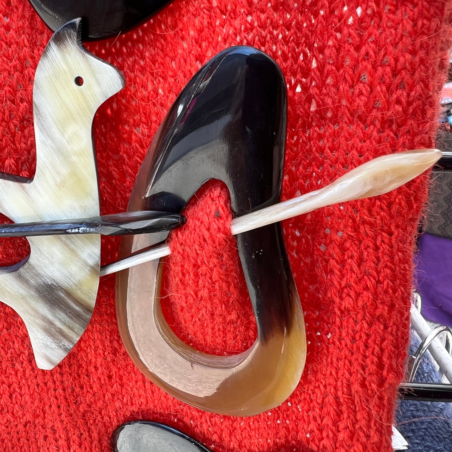 Luxury handmade sweater pins made from bull horns.