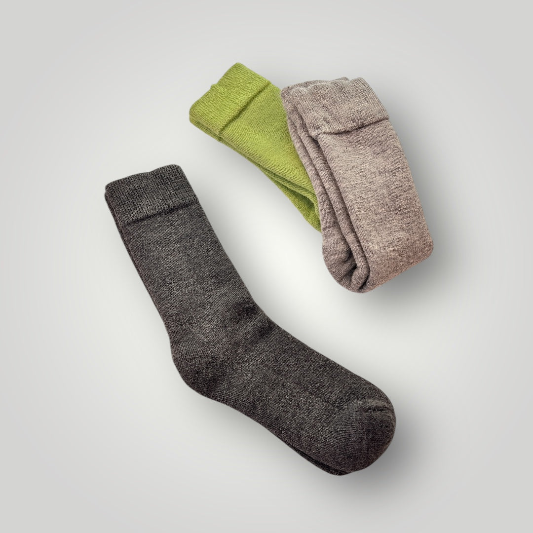 Charcoal, silver and amazon green color PacaTrek Alpaca socks. Gret for hiking, hunting, work or everyday life. Therapeutic, won't leave a dent in your leg and are moisture wicking. Best of all, they regulate heat. If the sun comes out, your feet will not get too hot.  also don't stink after hiking.
